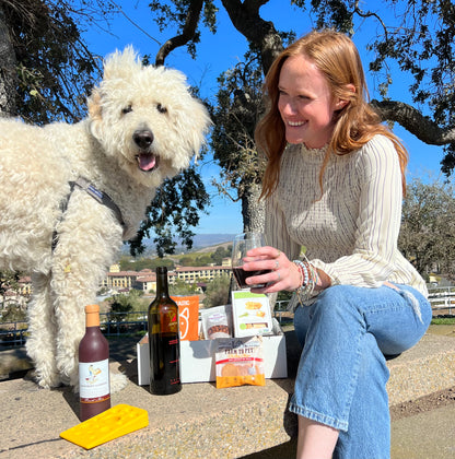sammy and lucca enjoying the vine to canine buddies dog gift basket